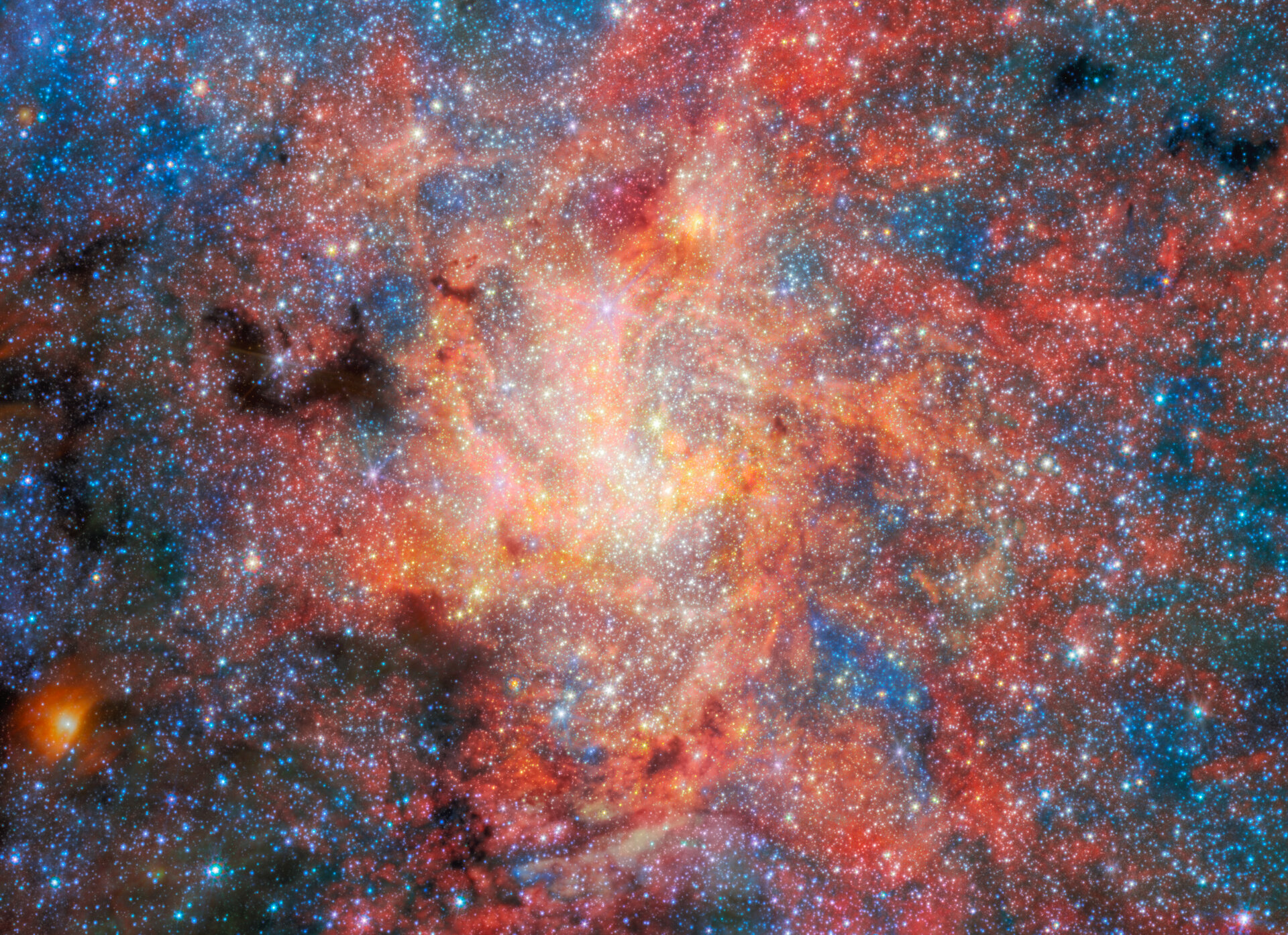 Campo estelar del centro de la Vía Láctea observado por Webb, con la estrella IRS 3 en una región cercana al agujero negro Sagittarius A*